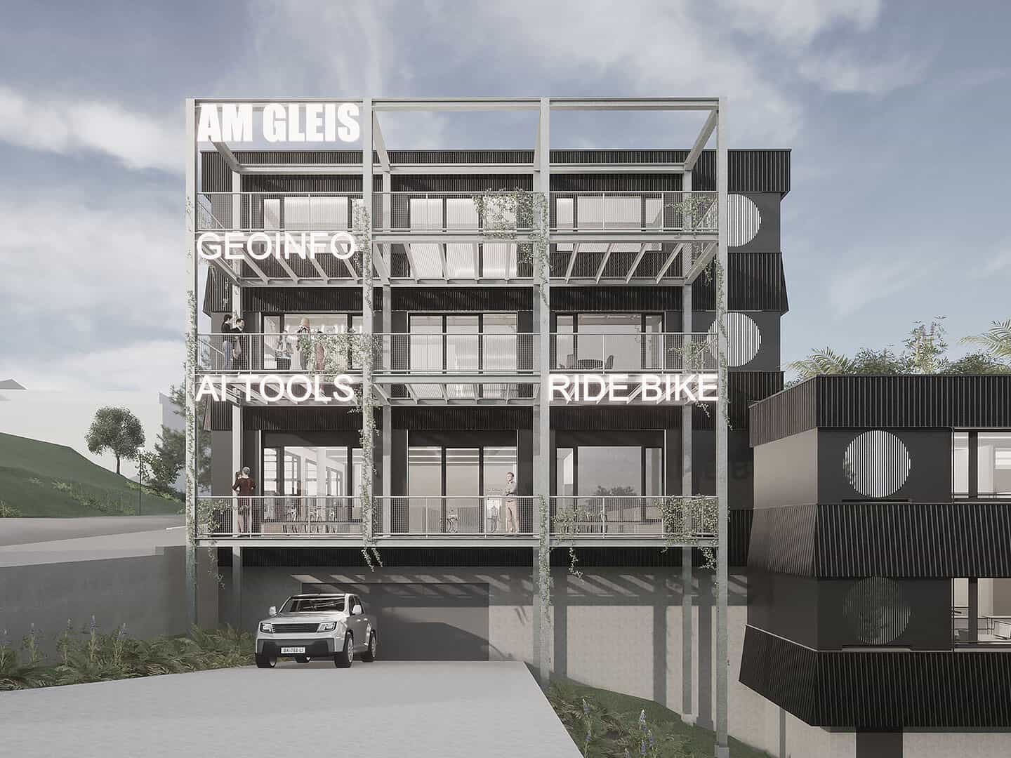 Modern multi-story building with open balconies, signage with words "GEOINFO," "ANTIQUES," and "RIDE BIKE," featuring a parking area underneath, set against a partly cloudy sky.